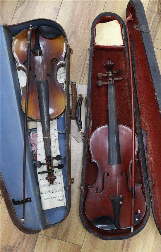 A full size violin, label Celebre Vosjen with case and a ¾ size violin bearing Strad label, case and bow